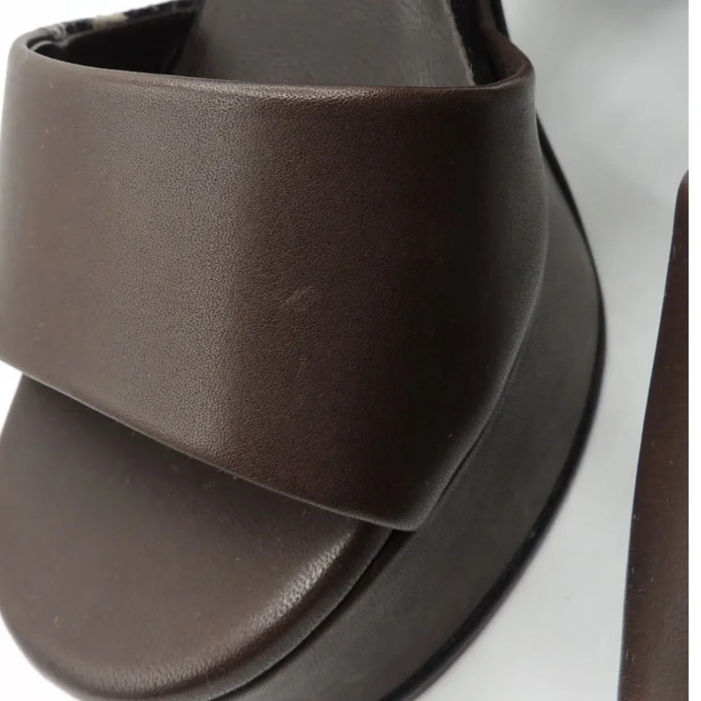 See by Chloe . Black , brown and python print platform heels.